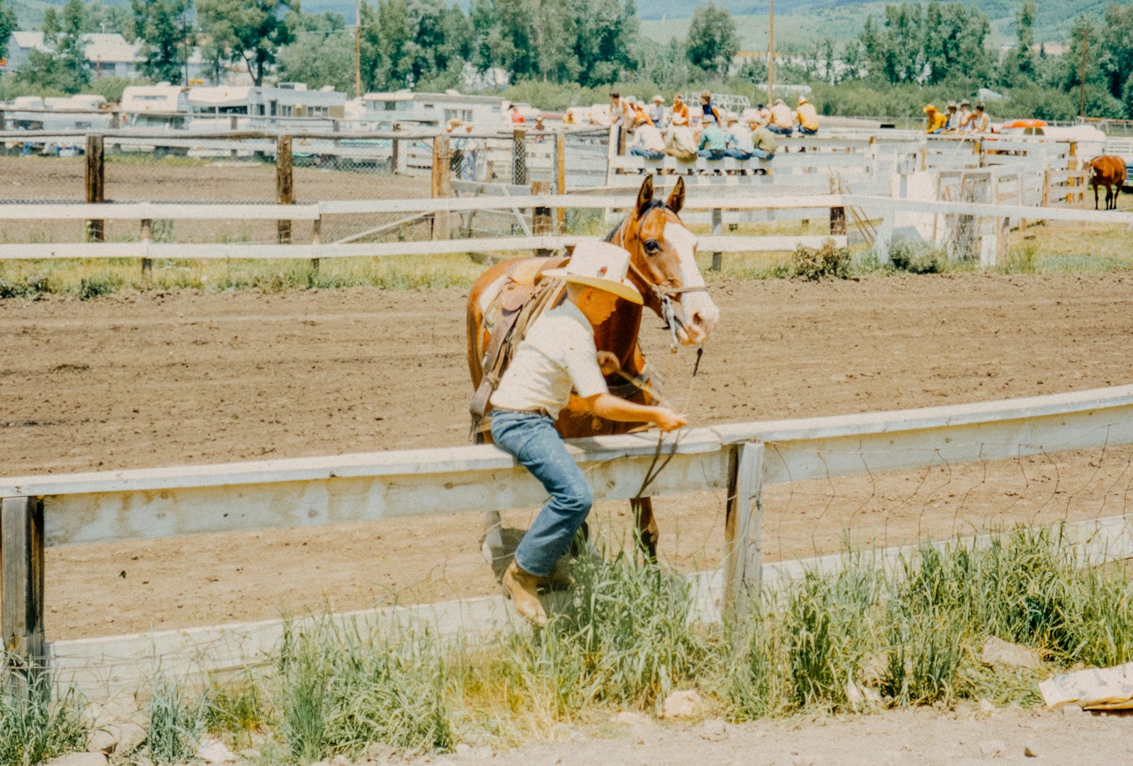 A man that is standing next to a horse